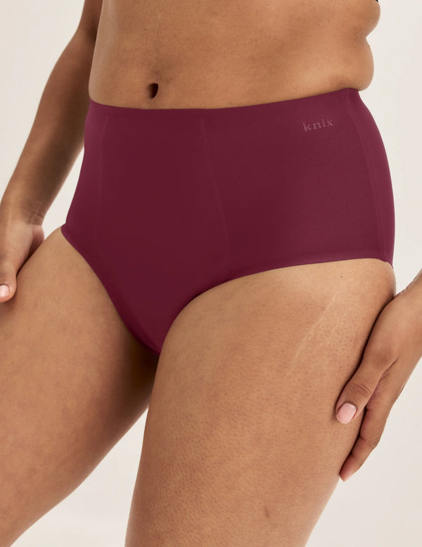 Ashley has 39” hips and wears KNIX S | Dark Cherry