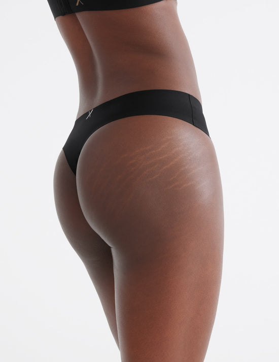 Abigail has 33" hips and wears a Knix size XS  | Black