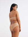 Chinthiya has 42" hips and wears a Knix size L | Warm Sand