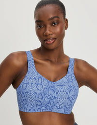 Front view of model wearing the Catalyst Sports Bra, highlighting the neckline, strap design, and smooth silhouette