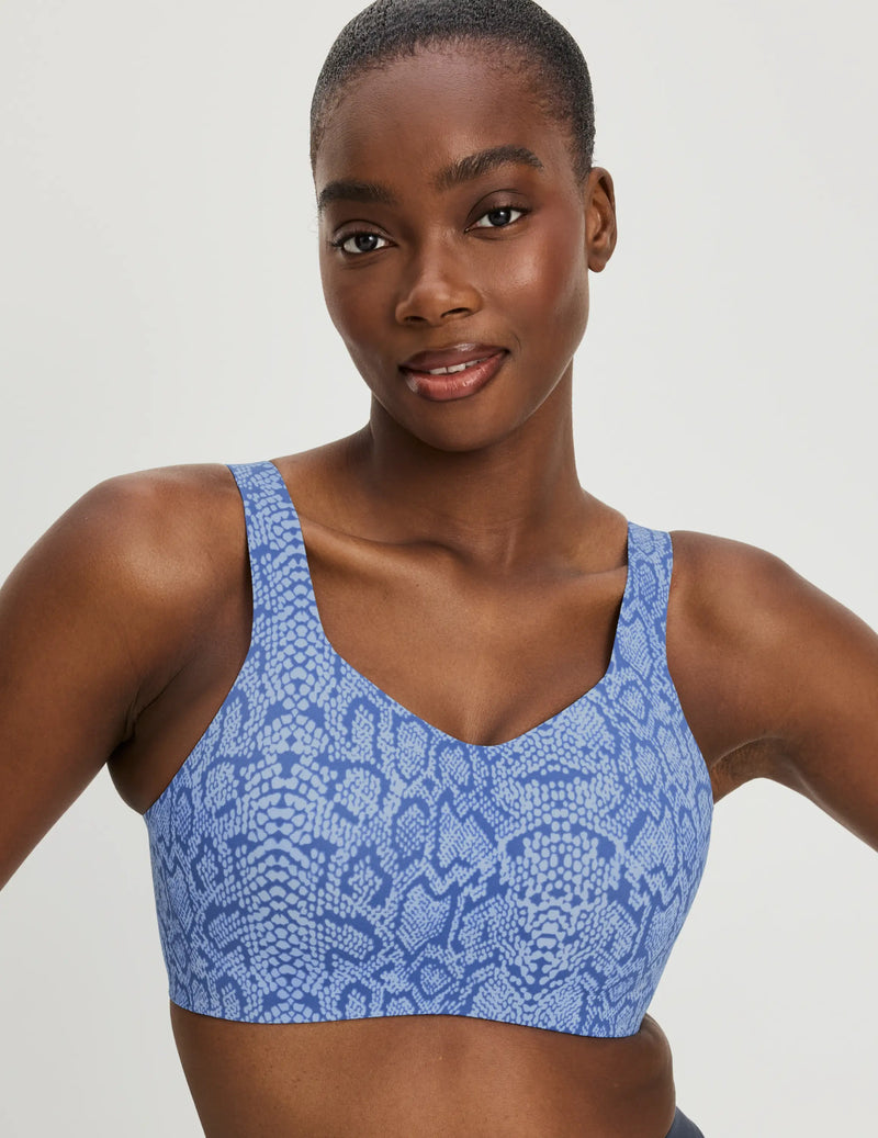 Front view of model wearing the Catalyst Sports Bra, highlighting the neckline, strap design, and smooth silhouette