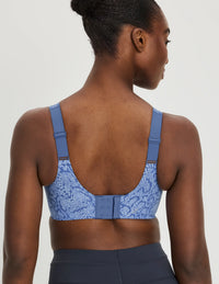 Back view of model wearing the Catalyst Sports Bra, highlighting the neckline, strap design, and smooth silhouette