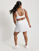 Adiya is a 36C and wearing KNIX L | White
