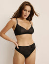 Sarah is a 34DD and wearing KNIX M+ | Black