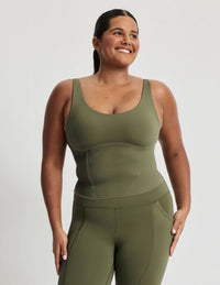 Adiya is a 36C and wears a Knix size L | Olive