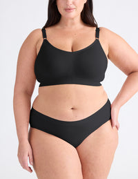 Full-body view of model wearing the Good to Go Seamless Bra, highlighting the neckline, strap design, and  silhouette