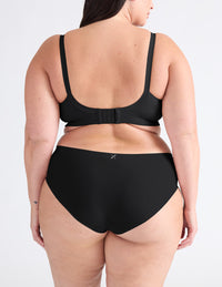 Back view of model wearing the Good to Go Seamless Bra, highlighting the neckline, strap design, and  silhouette