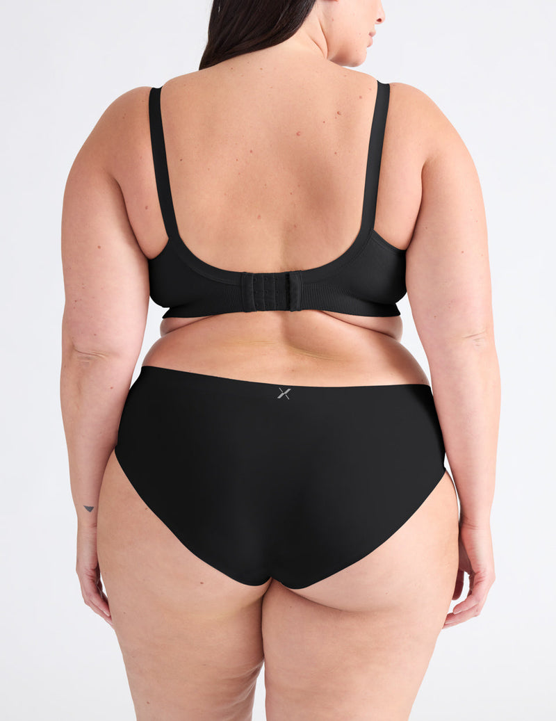 Back view of model wearing the Good to Go Seamless Bra, highlighting the neckline, strap design, and  silhouette