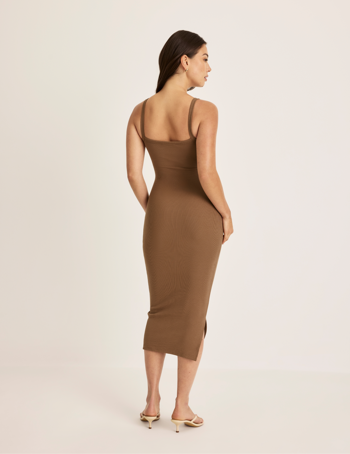 Alexandra is 5’8.5” tall and wearing KNIX S | Bark