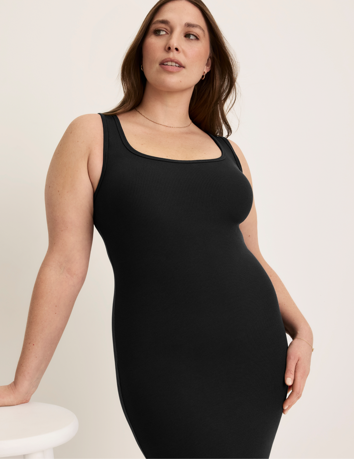Beatrice is 5’7.5” tall and wearing KNIX XL | Black