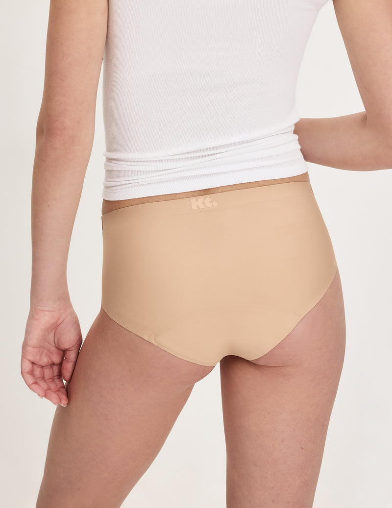 Back view of model wearing the Teen Super Leakproof® No-Show Boyshort highlighting the coverage and smooth fit