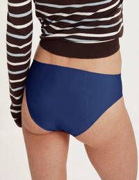 Back view of model wearing the Teen SuperPlus Leakproof® No-Show Bikini highlighting the coverage and smooth fit