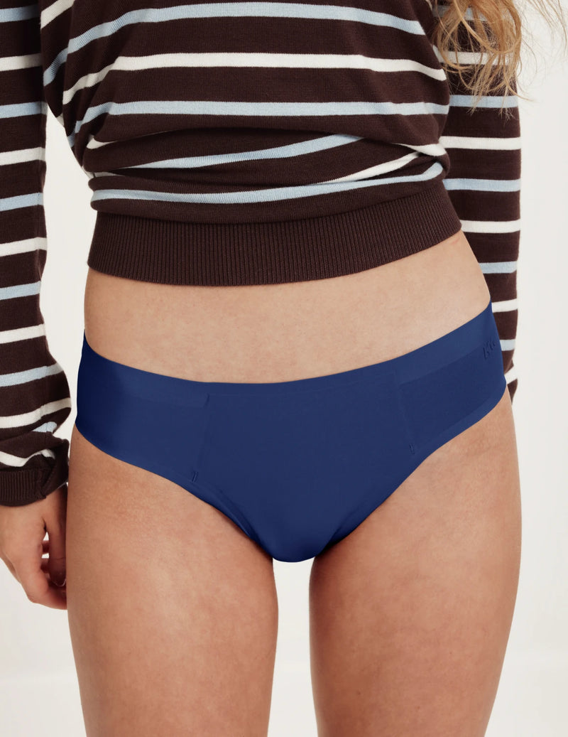 Front view of model wearing the Teen SuperPlus Leakproof® No-Show Bikini highlighting the coverage and smooth fit