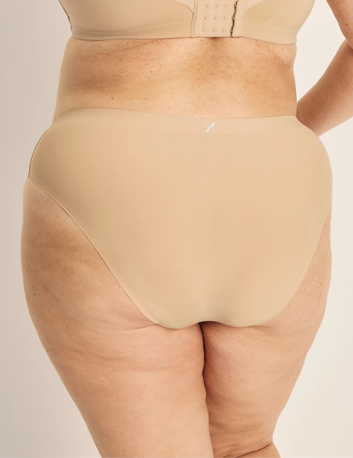 Clementine has 51” hips, and wearing KNIX XXL | Warm Sand