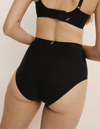 Molly has 35.5” hips, and wearing KNIX S | Black
