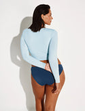 Maya is a 34DDD and is wearing a Knix size M | Blue Ice