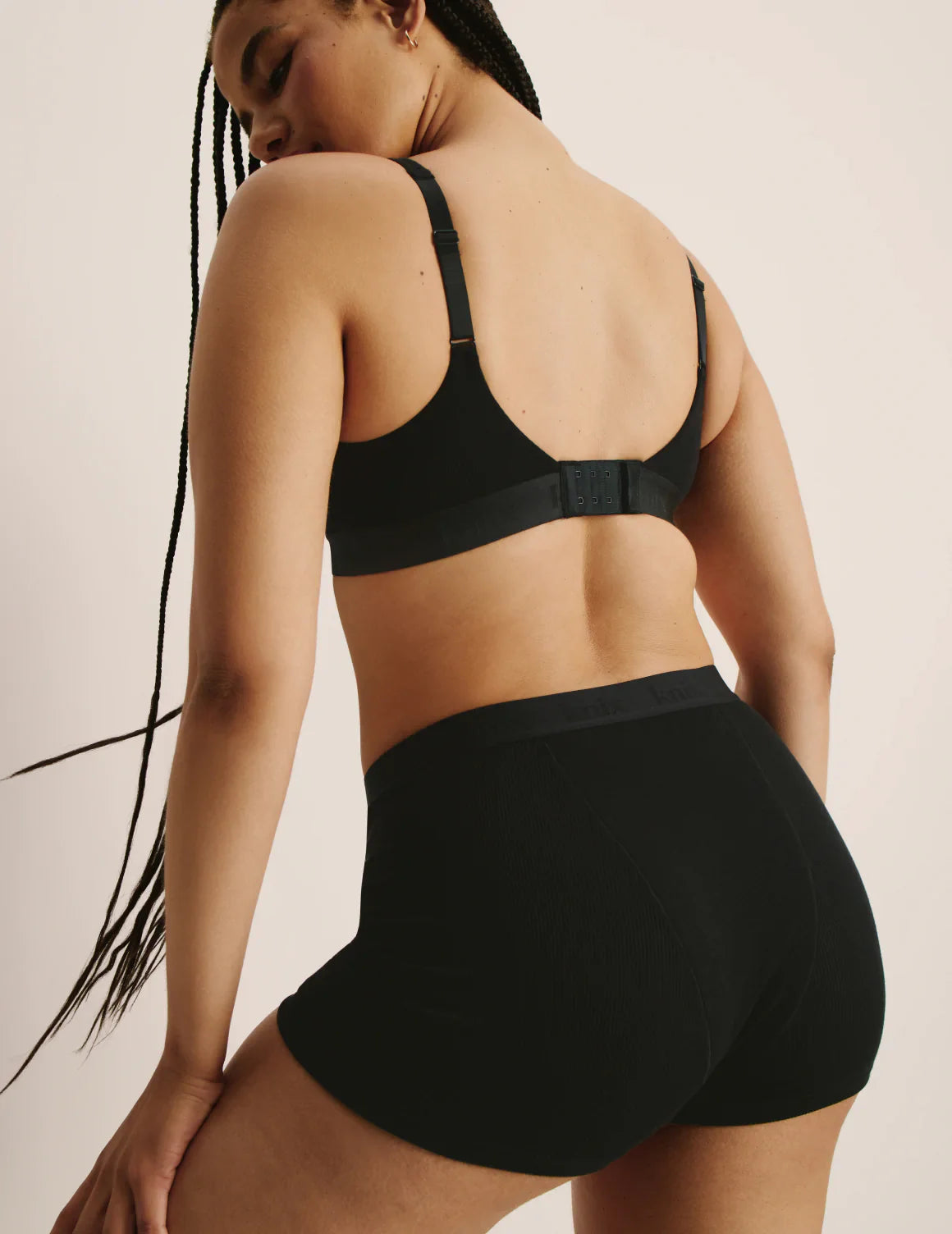 Abigail is a 34DD and wears a Knix size M+ | Black