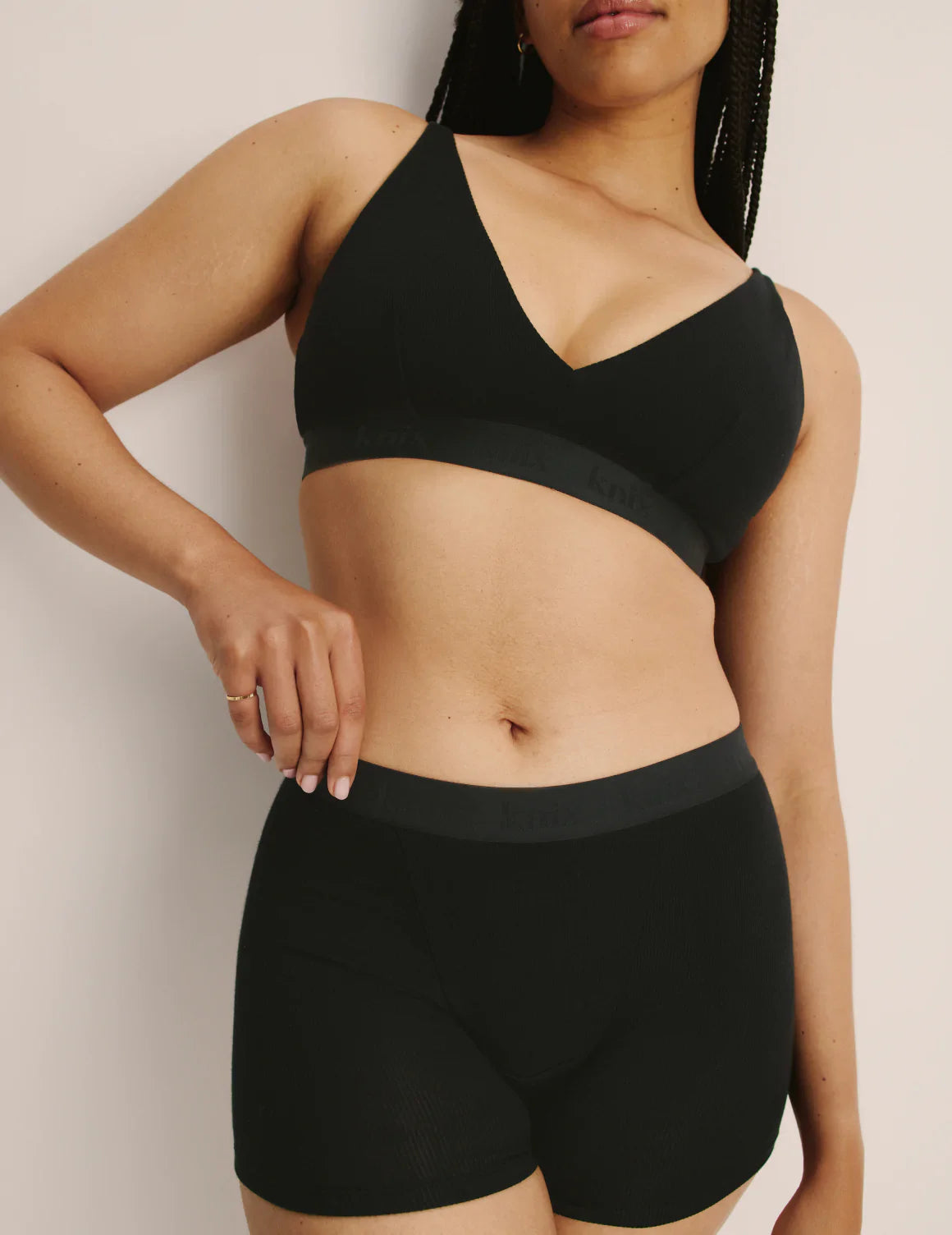 Abigail is a 34DD and wears a Knix size M+ | Black