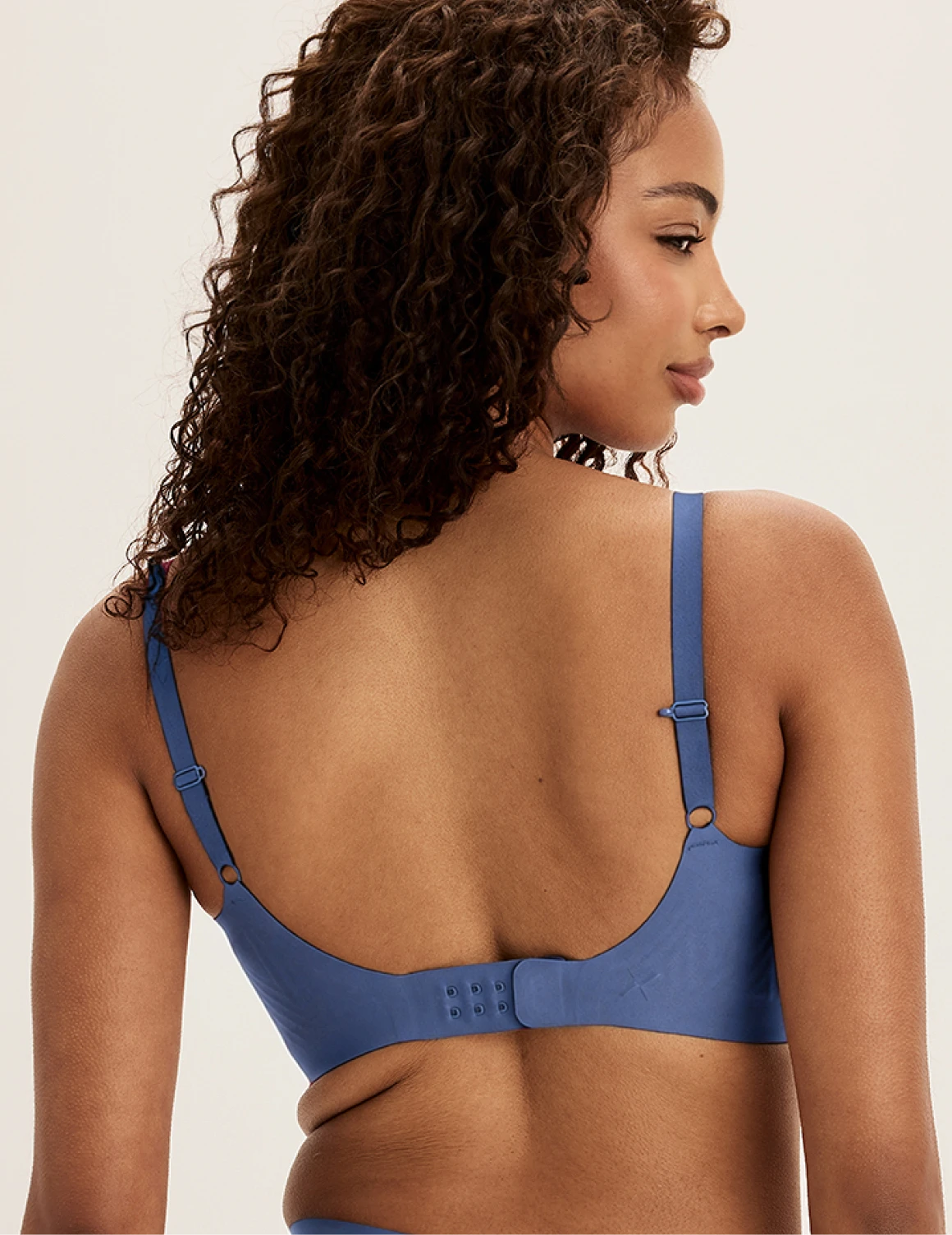 Ashley is a 34DD and wearing KNIX M+ | Indigo