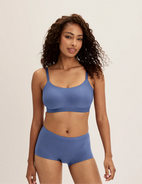 Ashley is a 34DD and wearing KNIX M+ | Indigo