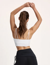 Maya is a 32A and wearing KNIX S | White