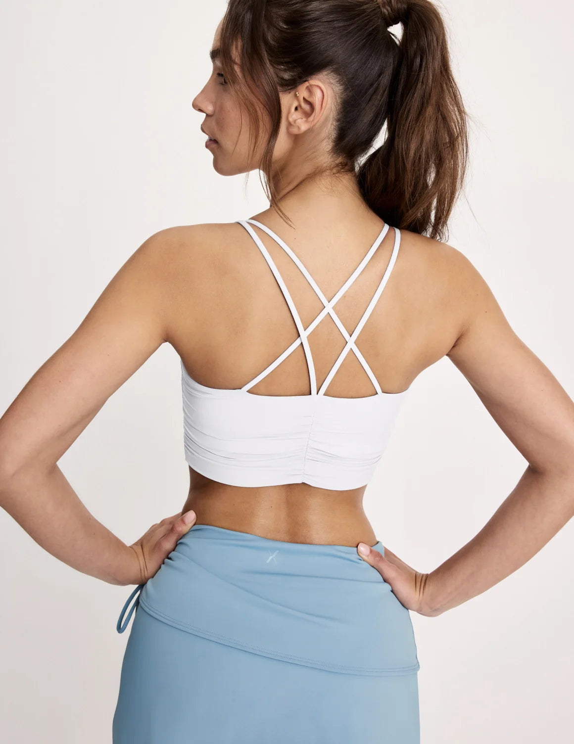 Maya is a 32A and wearing KNIX S | White