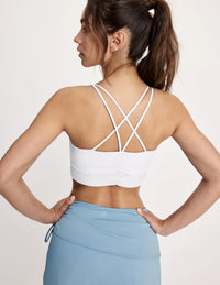 Maya is a 32A and wearing KNIX S | White