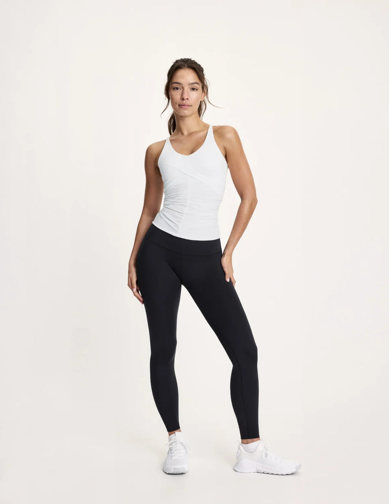 Maya is a 32A and wearing KNIX XS | White