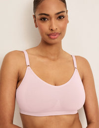 Front view of model wearing the Good to Go Seamless Bra, highlighting the neckline, strap design, and  silhouette
