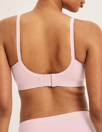 Back view of model wearing the Good to Go Seamless Bra, highlighting the neckline, strap design, and  silhouette