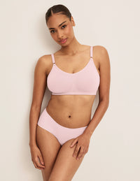 Front view of model wearing the Good to Go Seamless Bra, highlighting the neckline, strap design, and  silhouette