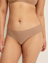 Front view of model wearing the Light Leakproof No-Show Bikini highlighting the coverage and smooth fit