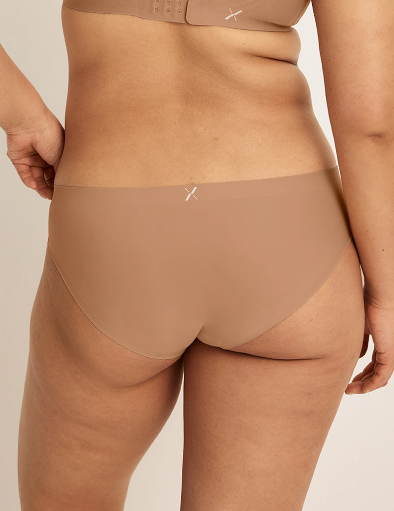 Back view of model wearing the Light Leakproof No-Show Bikini highlighting the coverage and smooth fit