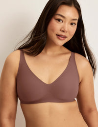 Front view of model wearing the Revolution V-Neck Bra, highlighting the neckline, strap design, and smooth silhouette