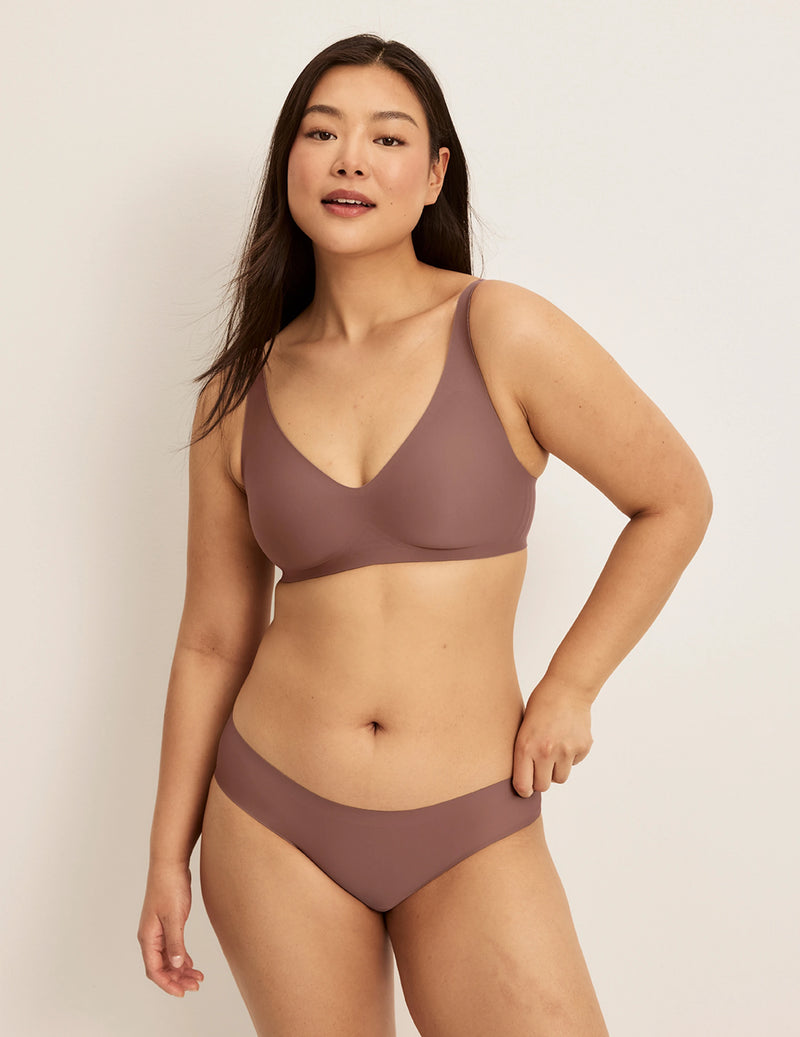 Front view of model wearing the Revolution V-Neck Bra, highlighting the neckline, strap design, and smooth silhouette